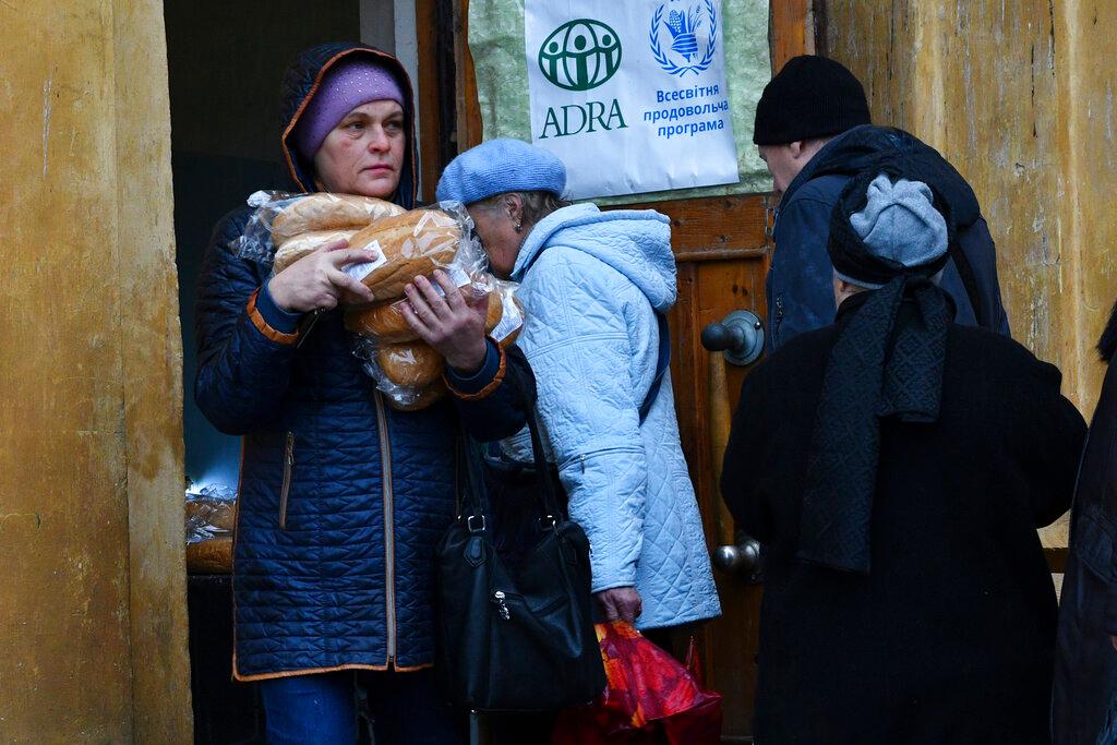 People receive bread at humanitarian aid center in Kramatorsk, Ukraine