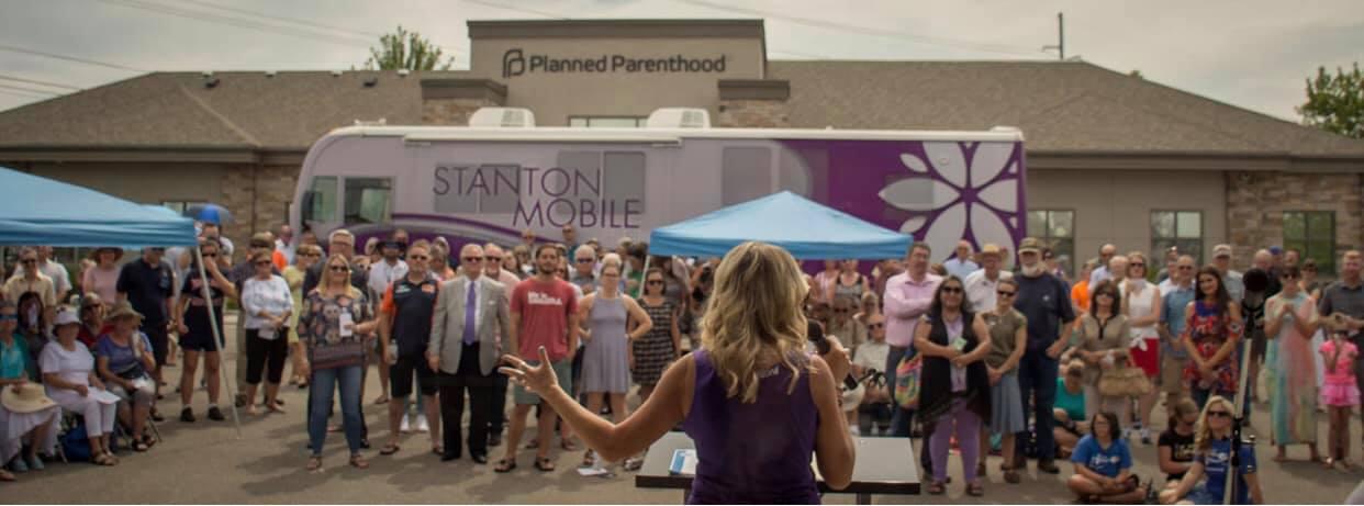 Brandi Swindell addresses attendees at the Grand Opening Dedication 