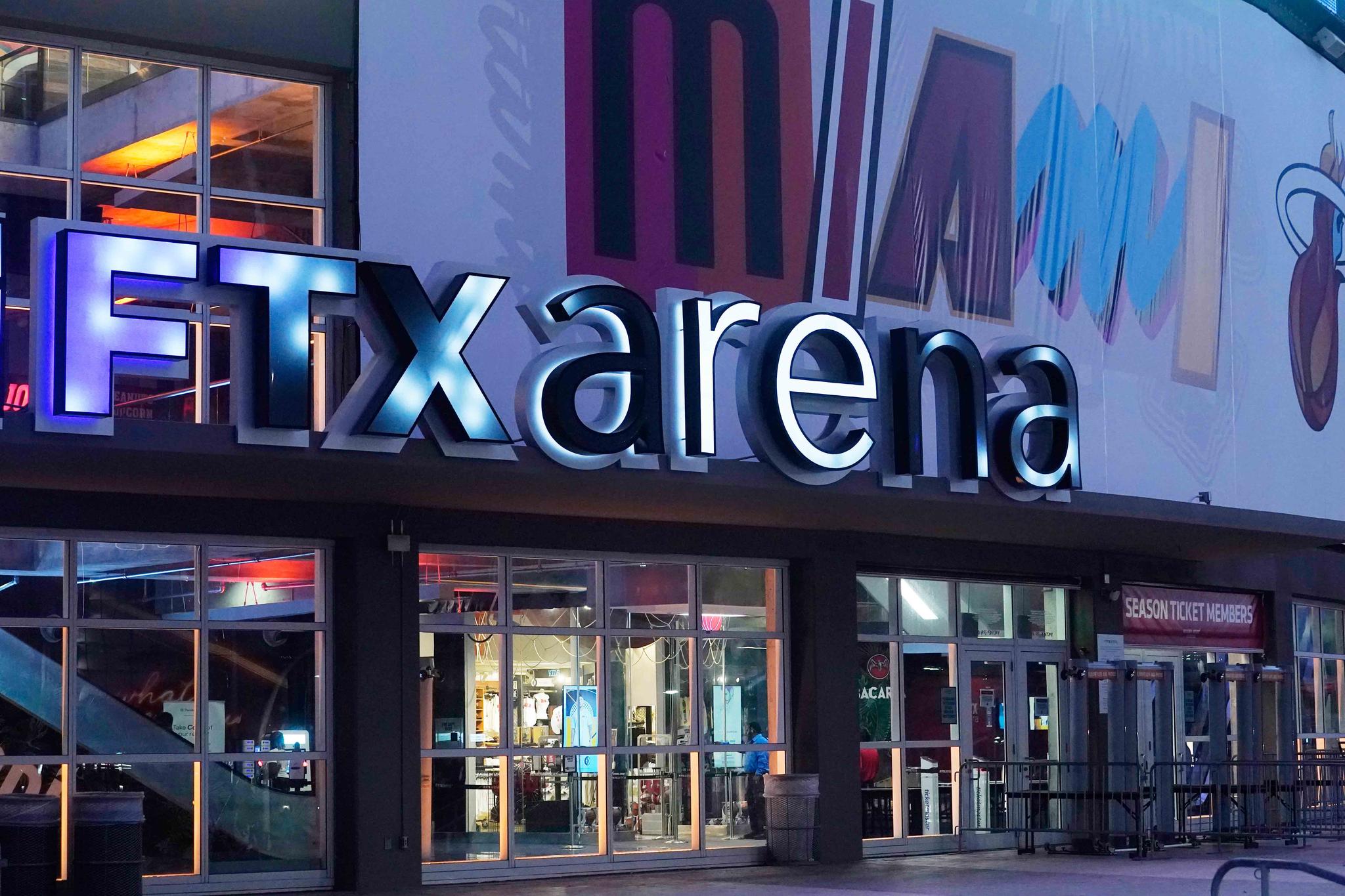 Signage for the FTX Arena, where the Miami Heat basketball team plays, is illuminated Saturday, Nov. 12, 2022, in Miami.