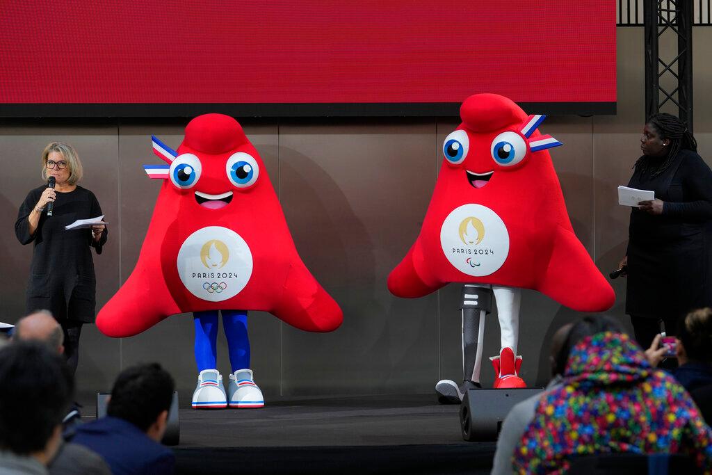 The mascots of the 2024 Paris Olympic Games, left, and Paralympic Games are presented Monday, Nov. 14, 2022 in Saint-Denis, outside Paris. The mascot, a Phrygian cap, also known as a liberty cap, is an updated version of a conical hat worn in antiquity in places such as Persia, the Balkans, Thrace, Dacia and Phrygia, where the name originates, in modern day Turkey. It later became a symbol of the pursuit of liberty in the French Revolution, and is still worn by the figure of Marianne, the national personification of France since that time.