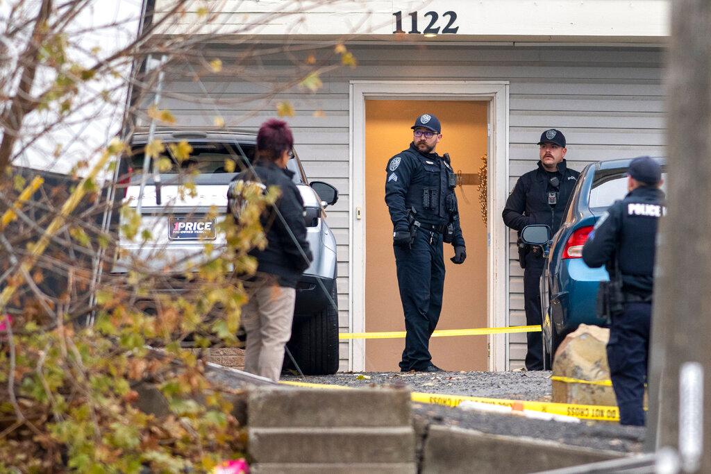 Officers investigate a homicides at an apartment complex south of the University of Idaho campus