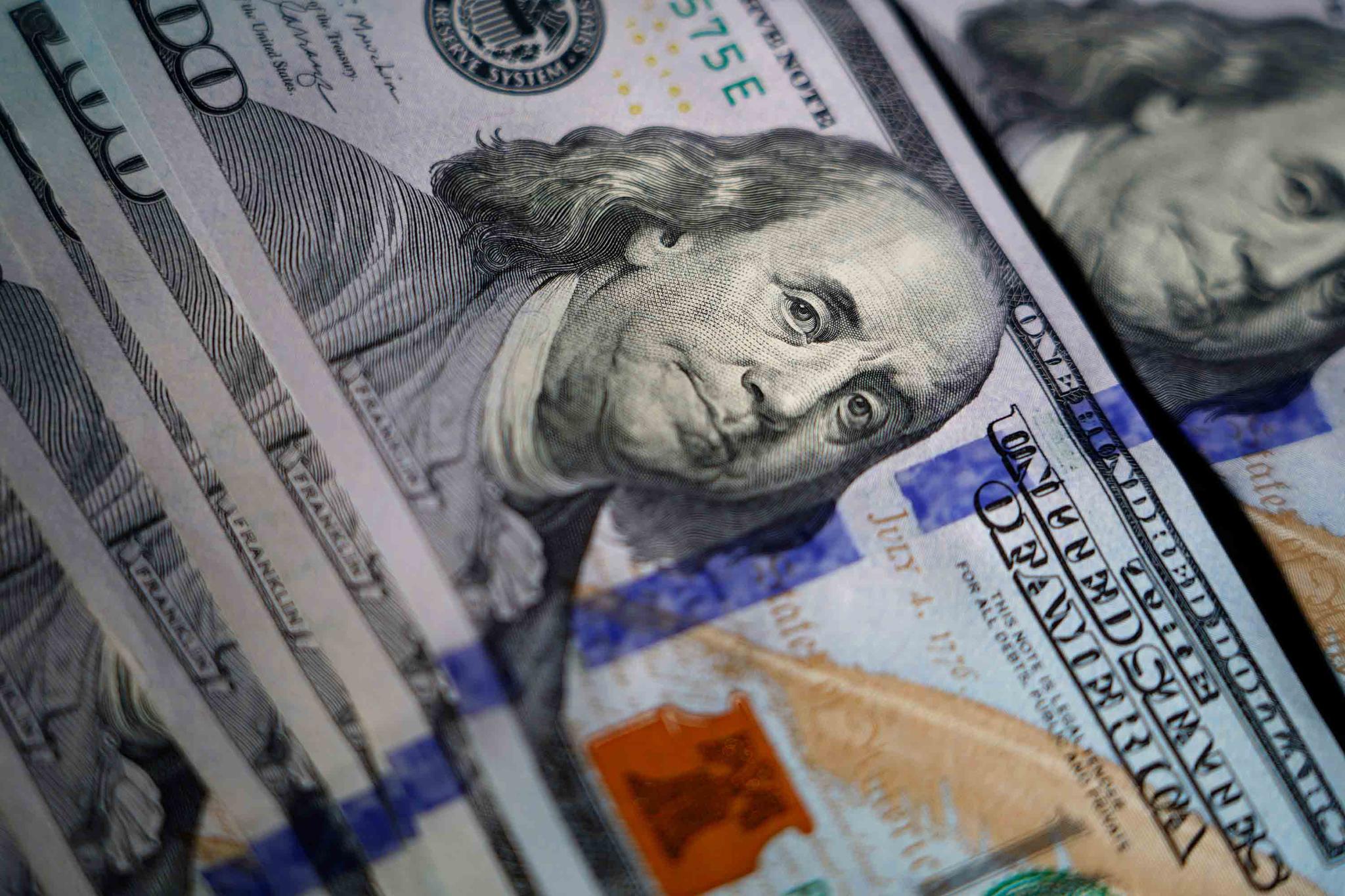 U.S. $100 bills are seen on July 14, 2022, in Marple Township, Pa. Giving Tuesday raised $3.1 billion in 24 hours for charitable causes in the U.S. on Tuesday, Nov. 29, 2022