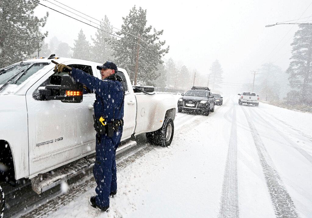 California Highway Patrol officer instructs driver he may continue on Highway 2 in his 4-wheel drive vehicle