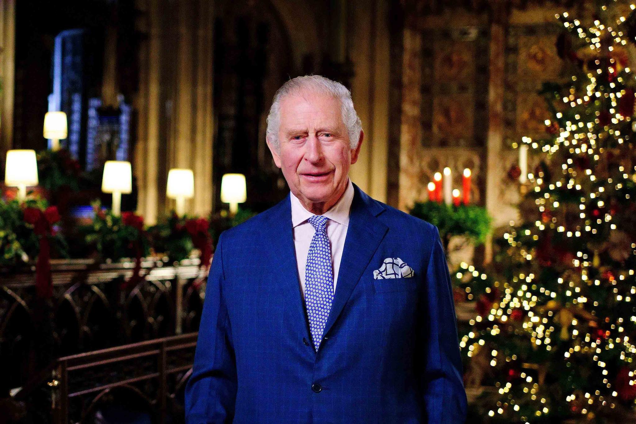 Britain's King Charles III delivers his message during the recording of his first Christmas broadcast in the Quire of St George's Chapel at Windsor Castle, Berkshire, England, Tuesday, Dec. 13, 2022.