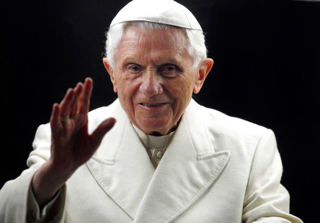  Pope Benedict XVI blesses the faithful as he arrives in St. Peter's Square at the Vatican to bless the nativity scene on Dec. 31, 2011. 