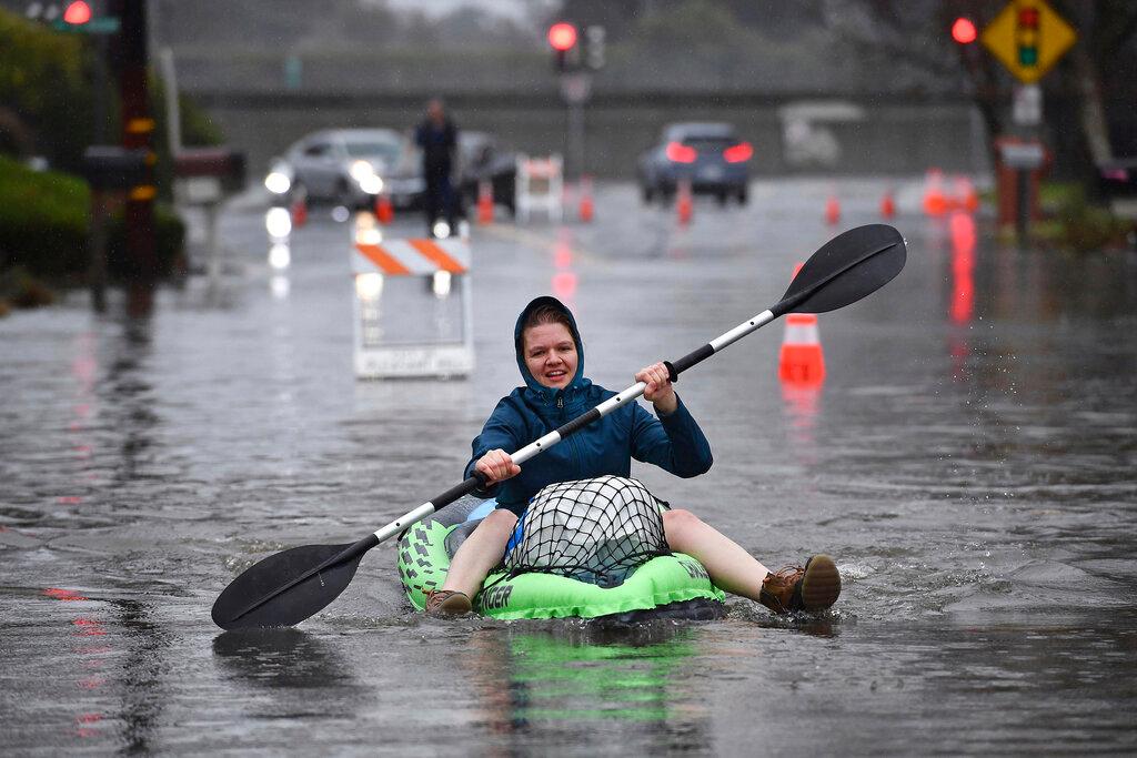 Katie Leonard uses a kayak to help bring supplies to others in Pleasant Hill, Calif.
