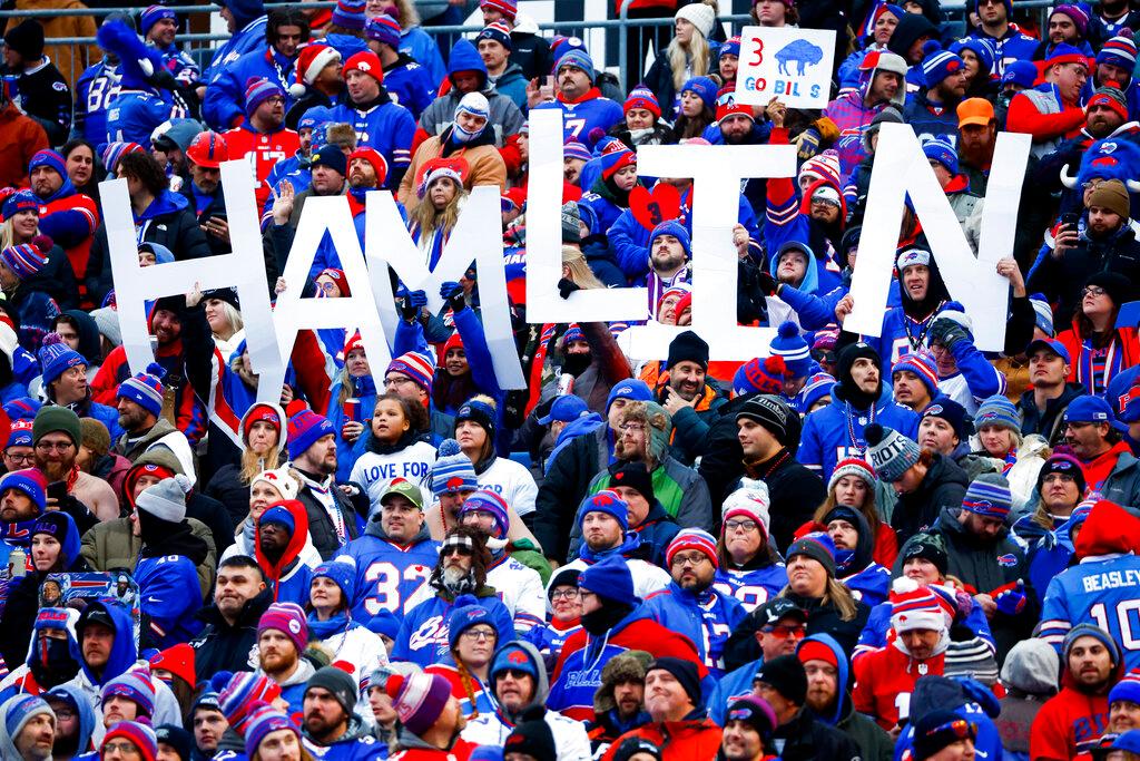 Fans hold a sign in support of Buffalo Bills safety Damar Hamlin during the second half of an NFL football game against the New England Patriots, Sunday, Jan. 8, 2023