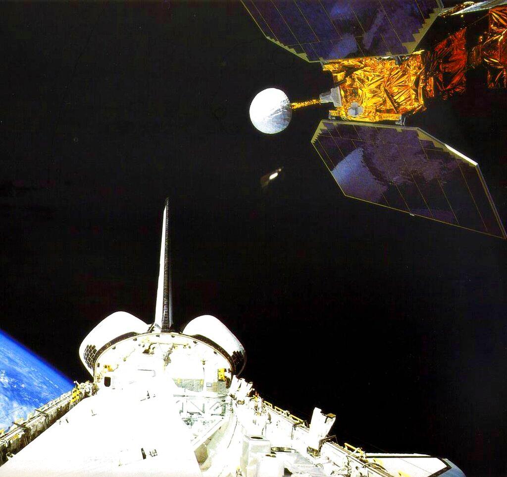 Space shuttle Challenger launches the Earth Radiation Budget Satellite in 1984