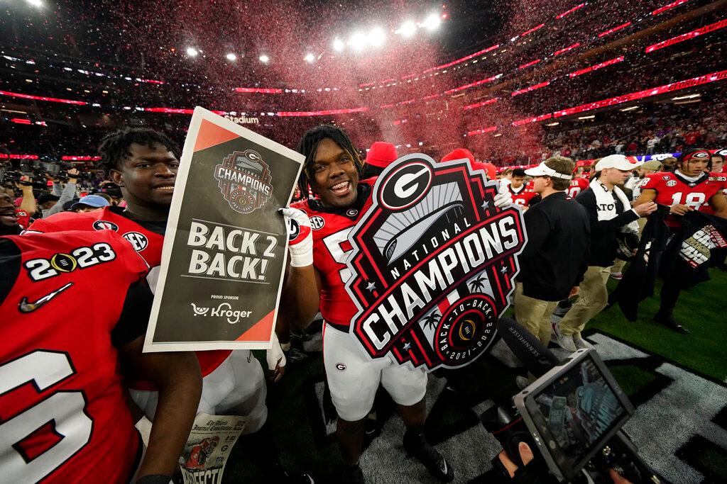 Georgia players celebrate a win over TCU after the national championship NCAA College Football Playoff game