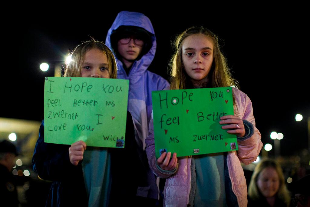Students express their support for Richneck Elementary School first-grade teacher Abby Zwerner during a candlelight vigil in her honor at the School Administration Building in Newport News, Va.