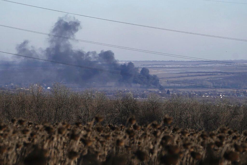 Smoke billows during fighting between Ukrainian and Russian forces in Soledar, Donetsk region, Ukraine, Wednesday, Jan. 11, 2023. Russia's Defense Ministry said Friday Jan. 13, 2023 that its forces have captured the salt-mining town of Soledar, A hard fought battle between Russian and Ukrainian forces for months. 