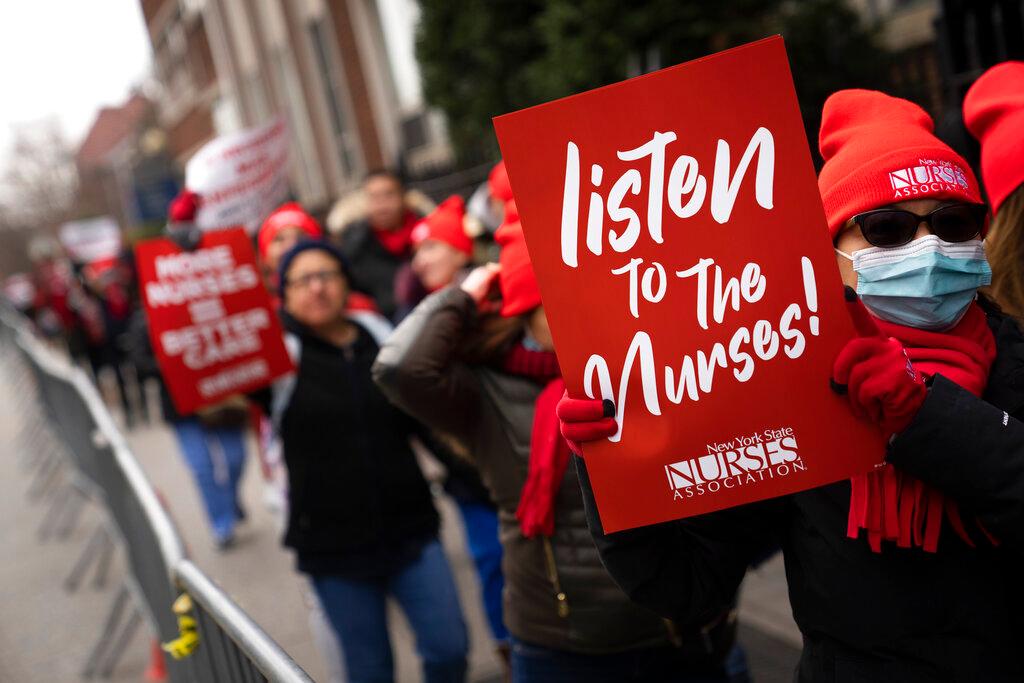Protestors march on the streets around Montefiore Medical Center during a nursing strike, Wednesday, Jan. 11, 2023.