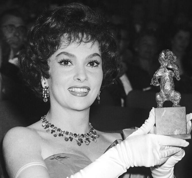 Italian actress Gina Lollobrigida shows the Silver Bear Award. 