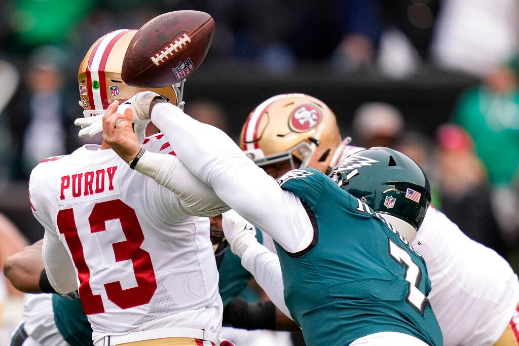 Philadelphia Eagles linebacker Haason Reddick, right, causes a fumble by San Francisco 49ers quarterback Brock Purdy during the first half of the NFC Championship NFL football game.