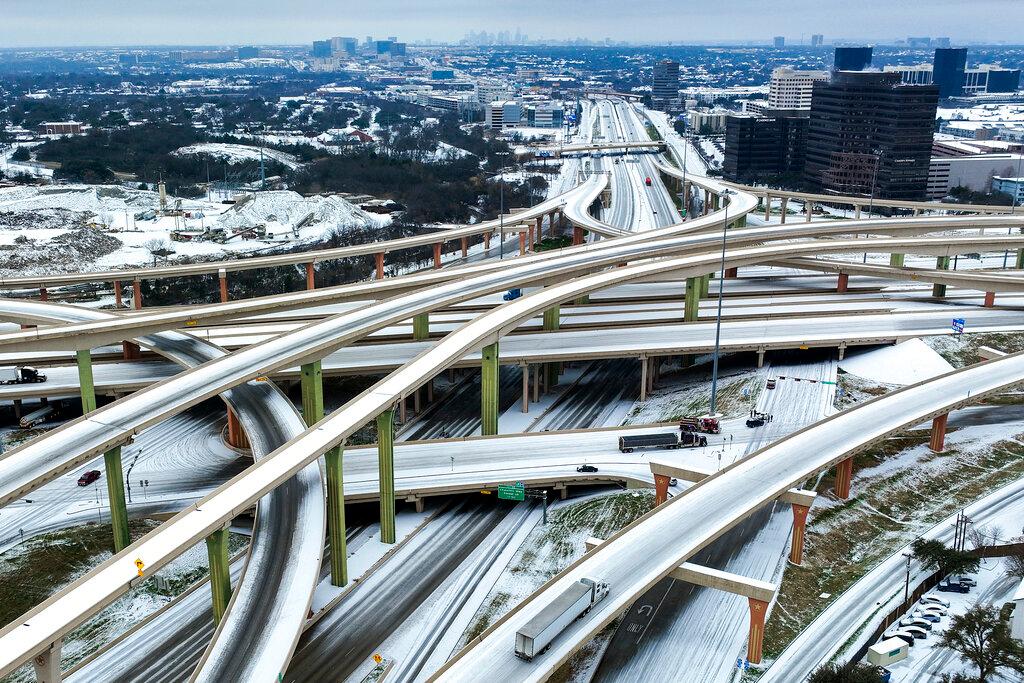 An icy mix covers the High Five Interchange at US 75 and I-635