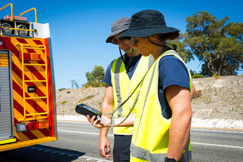 men searching for a radioactive capsule