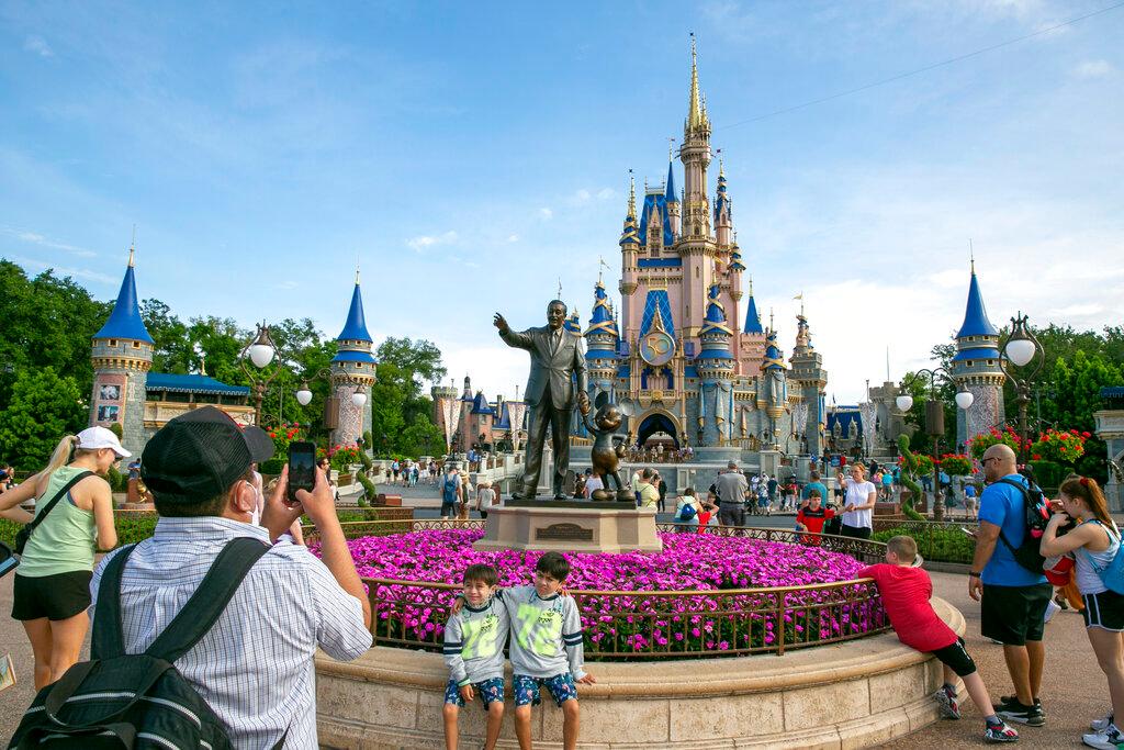 People visit Magic Kingdom Park at Walt Disney World Resort in Lake Buena Vista, Florida, on April 18, 2022. Union members voted down a contract proposal covering tens of thousands of Walt Disney World service workers, Saturday, Feb. 4, 2023, saying it didn't go far enough toward helping employees face cost-of-living hikes in housing and other expenses in central Florida.