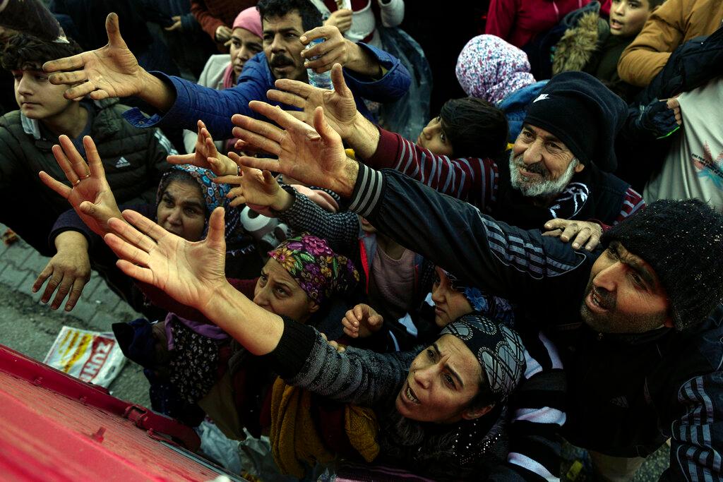 Volunteers distribute aid to people in Antakya, southern Turkey