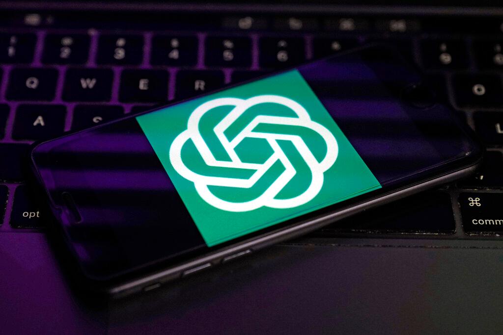 Logo for OpenAI, the maker of ChatGPT, appears on a mobile phone