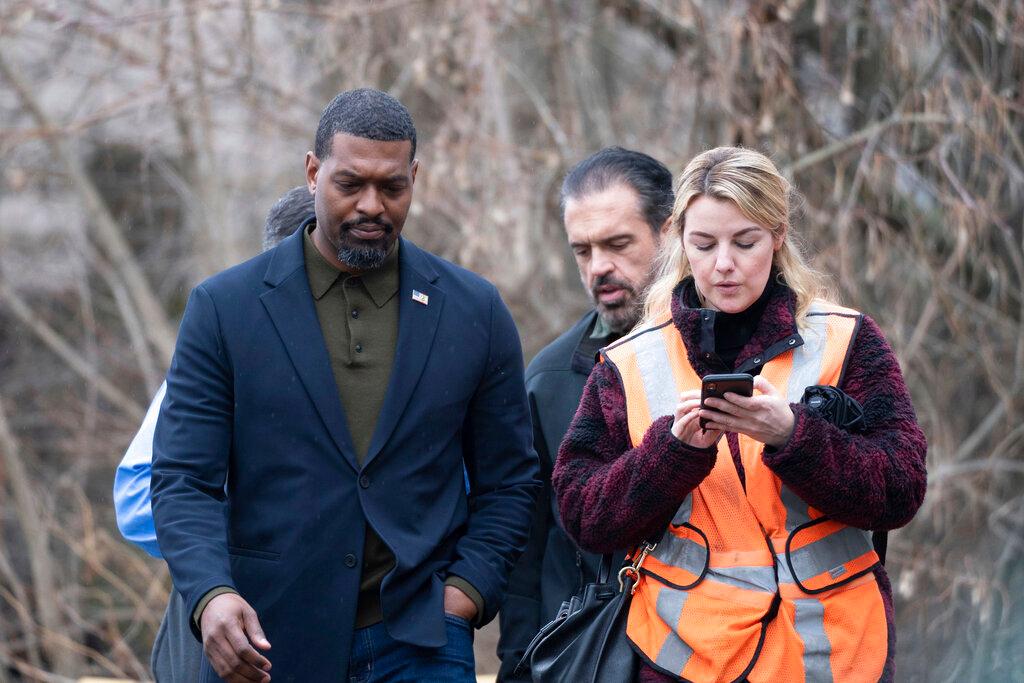 Environmental Protection Agency Administrator Michael Regan left, walks with his staff through East Palestine, Ohio on Thursday, Feb. 16, 2023. 
