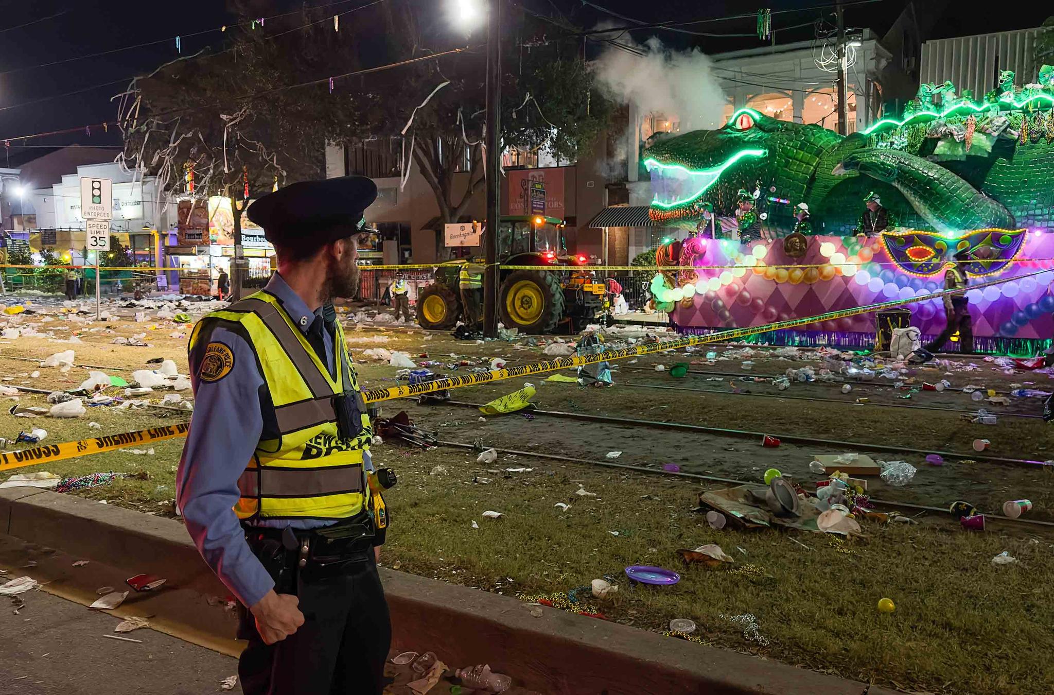 Police work the scene of a shooting at the Krewe of Bacchus parade on Sunday, Feb. 19, 2023.