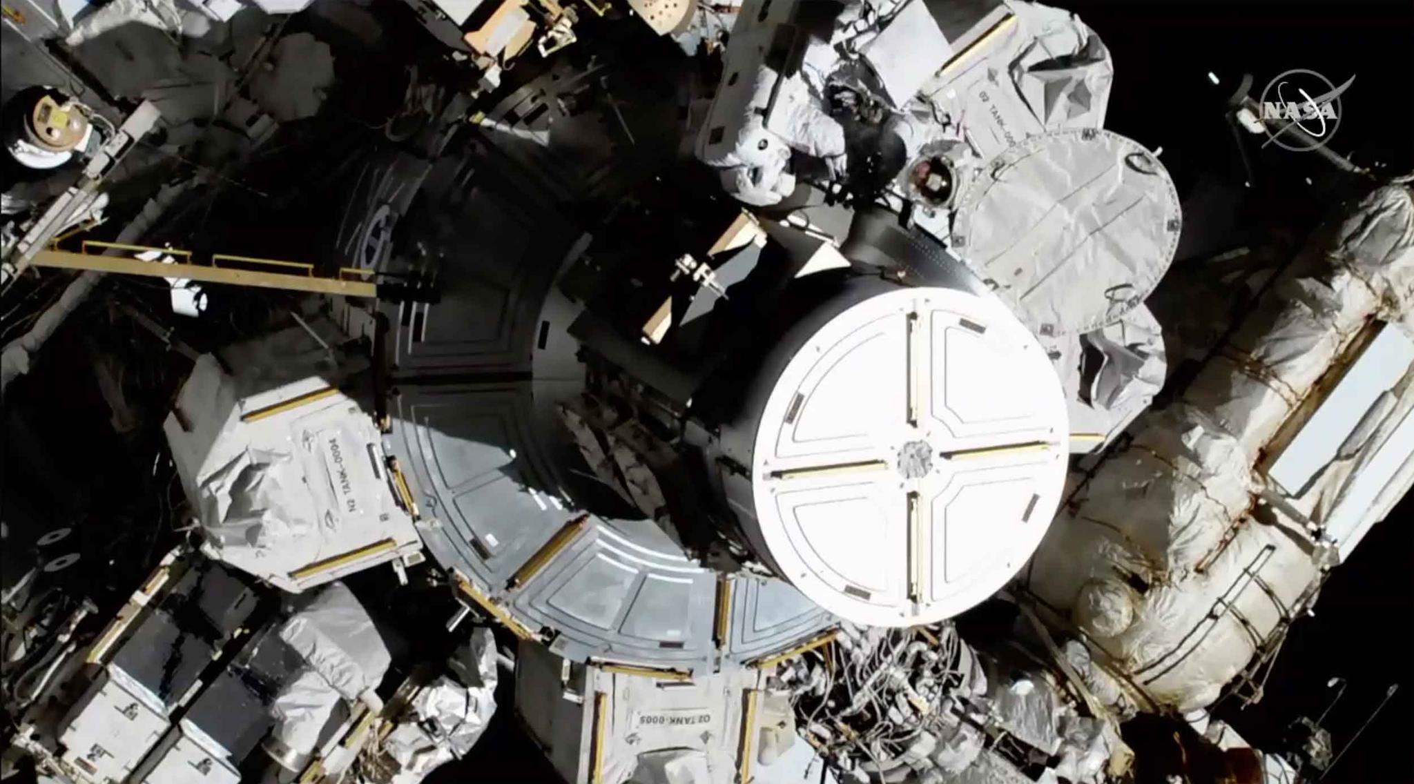 Female astronauts doing repairs on International Space Station