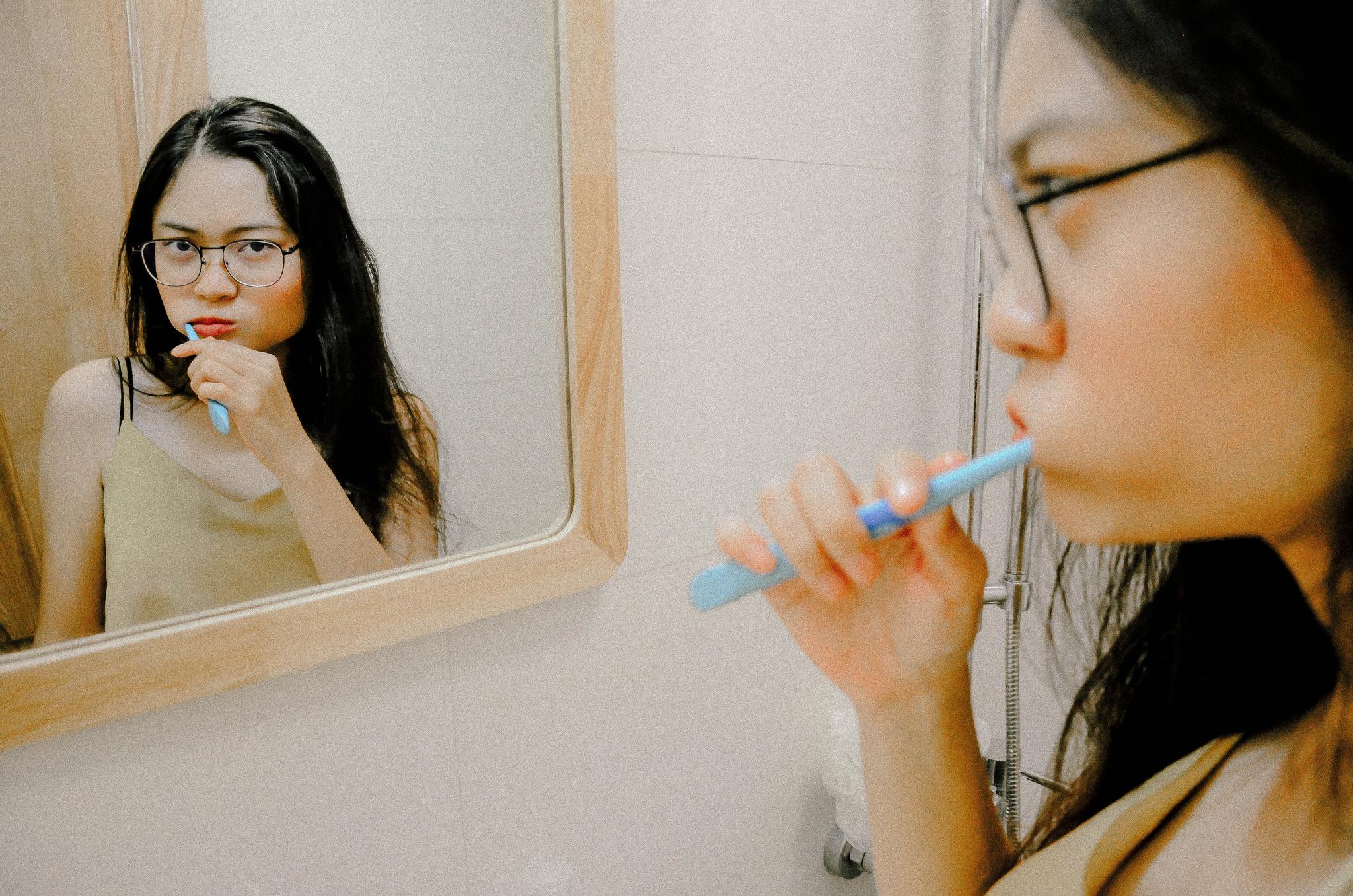 woman brushing teeth