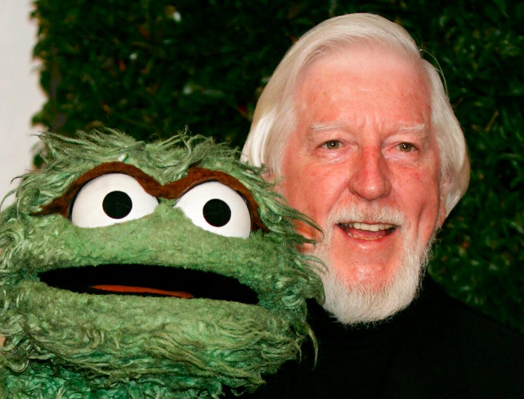 Caroll Spinney, right, who portrays "Sesame Street" characters Oscar The Grouch, left, and Big Bird, arrives for the Daytime Emmy nominee party at the Hollywood Roosevelt Hotel in Los Angeles. Spinney, who gave Big Bird his warmth and Oscar the Grouch his growl for nearly 50 years on "Sesame Street," died Sunday, Dec. 8, 2019, at the age of 85 at his home in Connecticut, according to the Sesame Workshop.