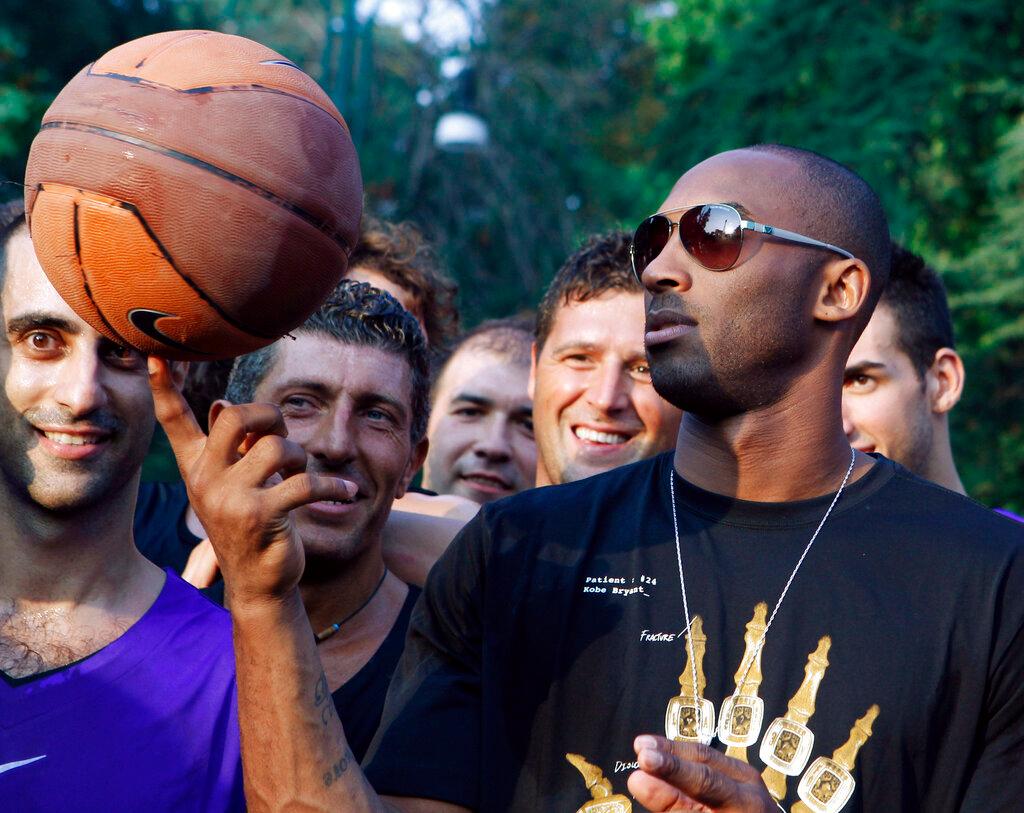 Kobe Bryant spins basketball