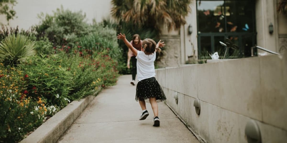 kids running with arms open to hug adult