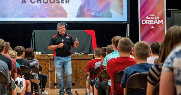 Randy Rich talks to a school assembly