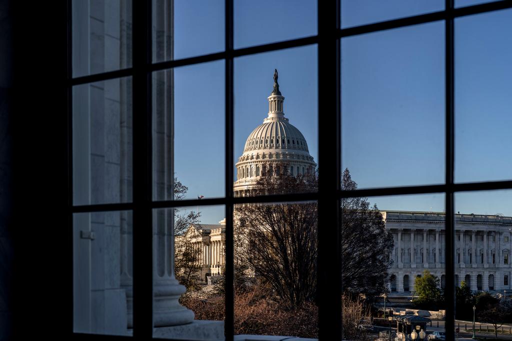 The Capitol is seen through a window in the Russell Senate Office Building as policymakers wrestle with fallout from the failure of Silicon Valley Bank, in Washington, March 15, 2023.