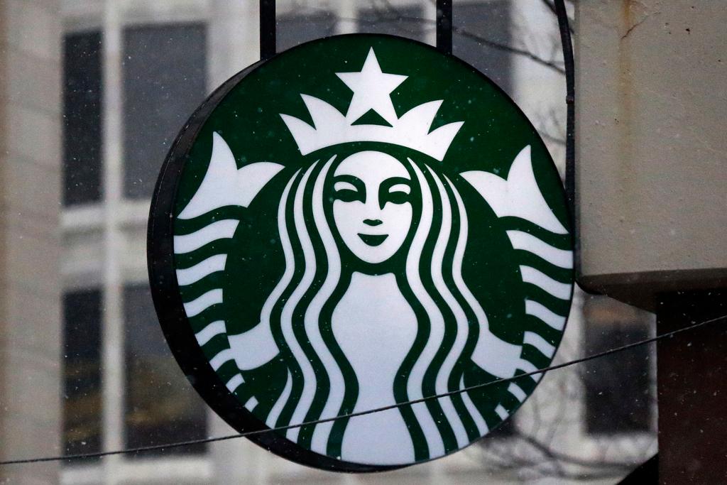 FILE - The Starbucks logo is seen on a shop, March 14, 2017, in downtown Pittsburgh. Starbucks is increasing pay and benefits for most of its U.S. hourly workers after ending its fiscal year with record sales. But the company said Monday, Nov. 6, 2023, that unionized workers won't be eligible for some of those perks, a sign of the continuing tension between the Seattle coffee giant and the union trying to organize its U.S. stores.