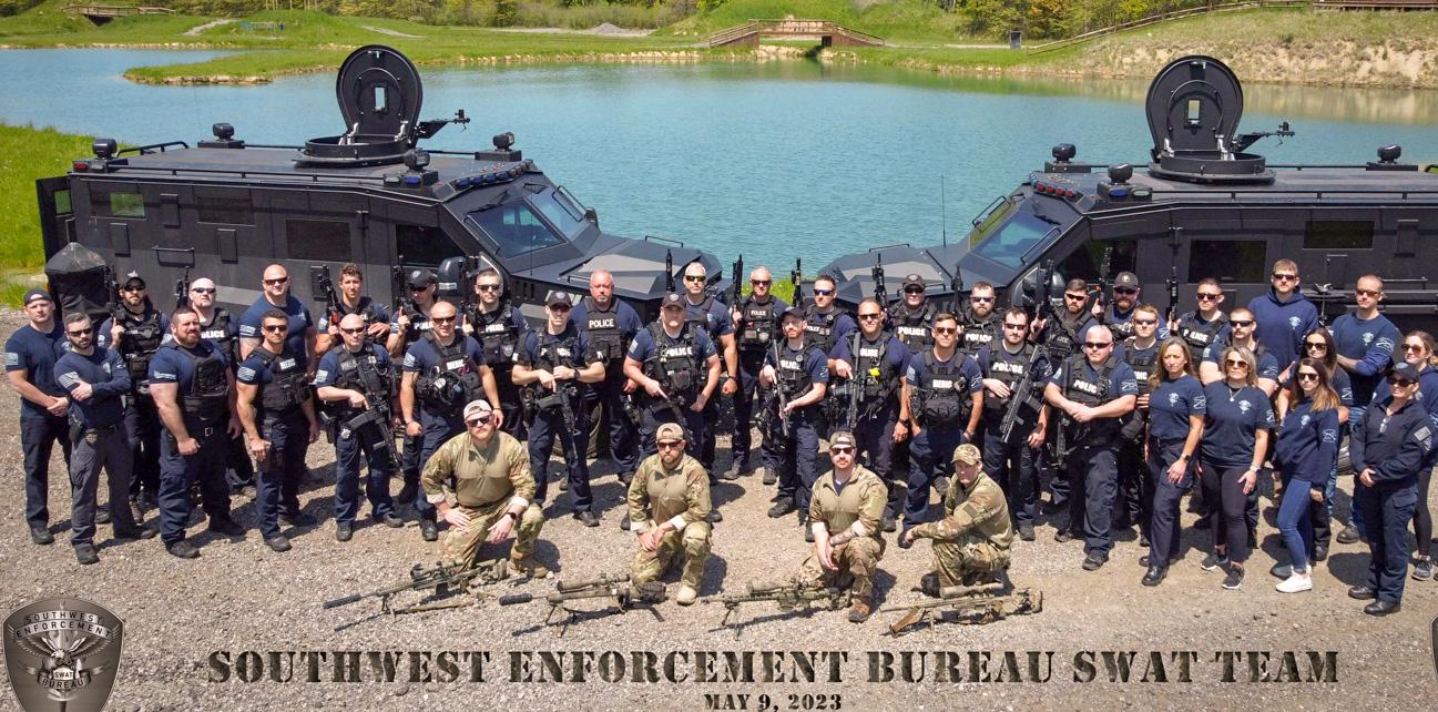 Derek Zelenka (far left) with the Southwest Enforcement Bureau SWAT team 