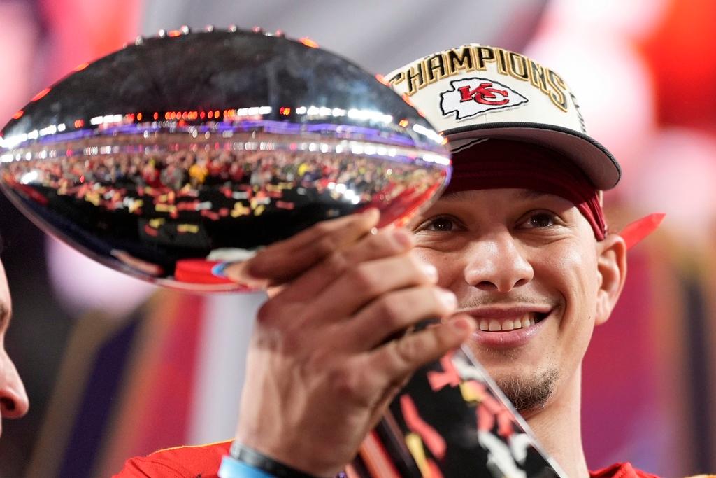 Kansas City Chiefs quarterback Patrick Mahomes holds the Vince Lombardi Trophy after the NFL Super Bowl 58 football game against the San Francisco 49ers