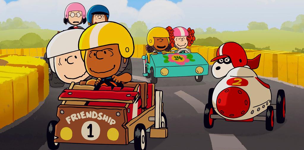 Charlie Brown, left, riding with Franklin as Snoopy follows at right, in a scene from the animated special “Snoopy Presents: Welcome Home, Franklin"