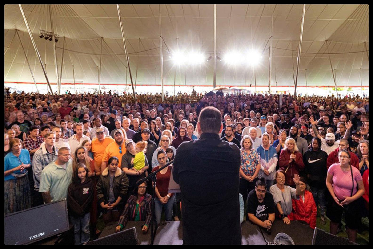 View of a large crowd under a tent