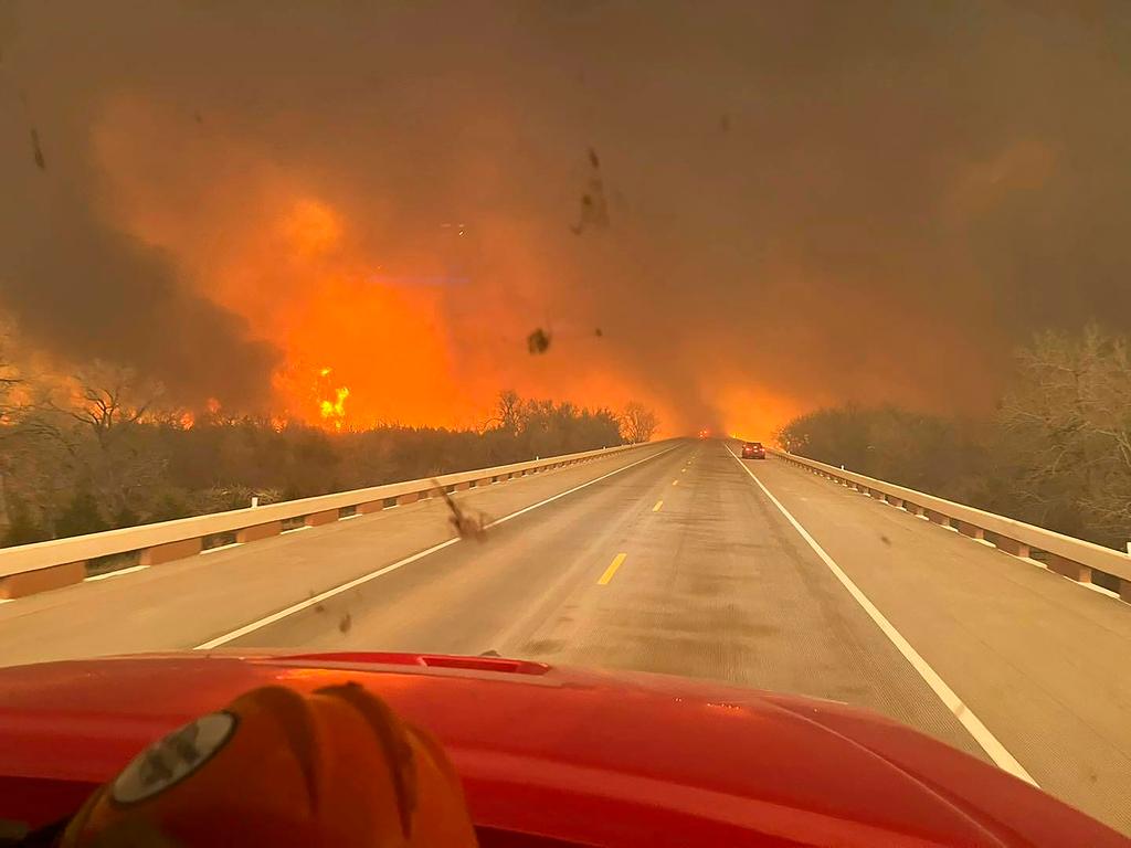 A fast-moving wildfire burning through the Texas Panhandle grew into the second-largest blaze in state history, forcing evacuations and triggering power outages