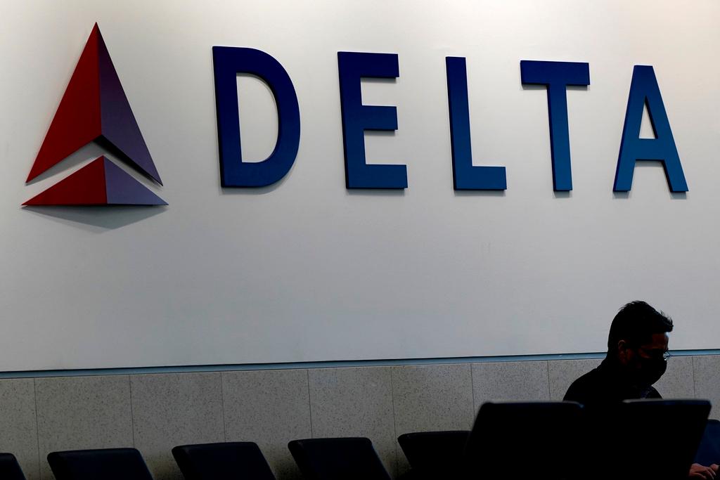 Person waits for a Delta Air Lines flight at Hartsfield-Jackson International Airport in Atlanta