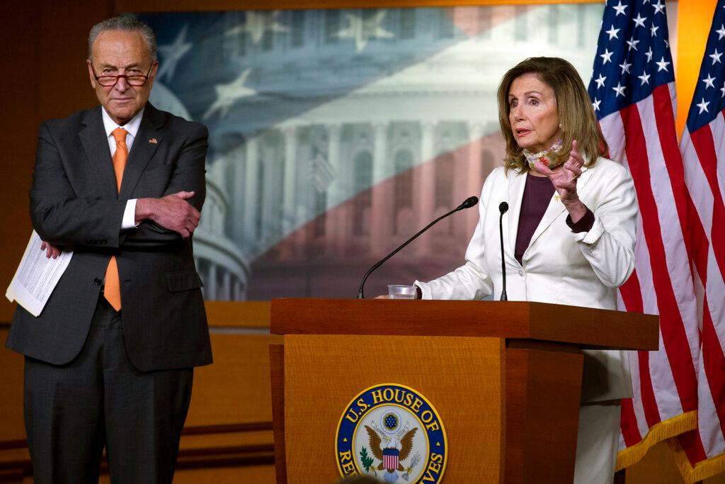 House Speaker Nancy Pelosi of Calif., joined by Senate Minority Leader Sen. Chuck Schumer of N.Y., speaks during a news conference on Capitol Hill in Washington, Thursday, Aug. 6, 2020.