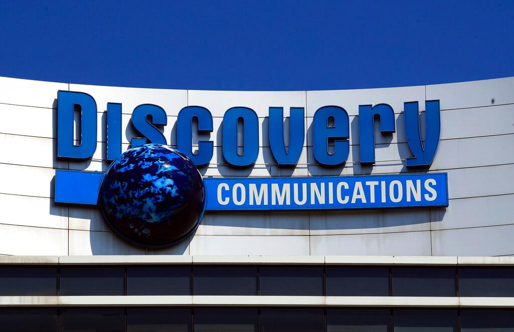 Discovery Communications logo sits atop its headquarters