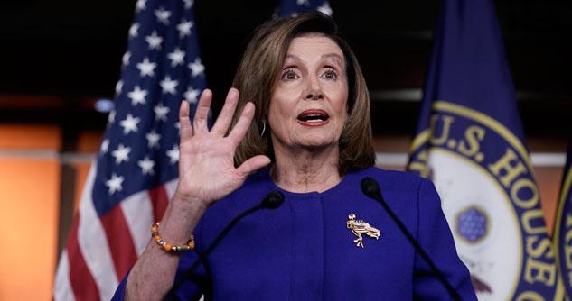 House Speaker Nancy Pelosi with hand up in the air