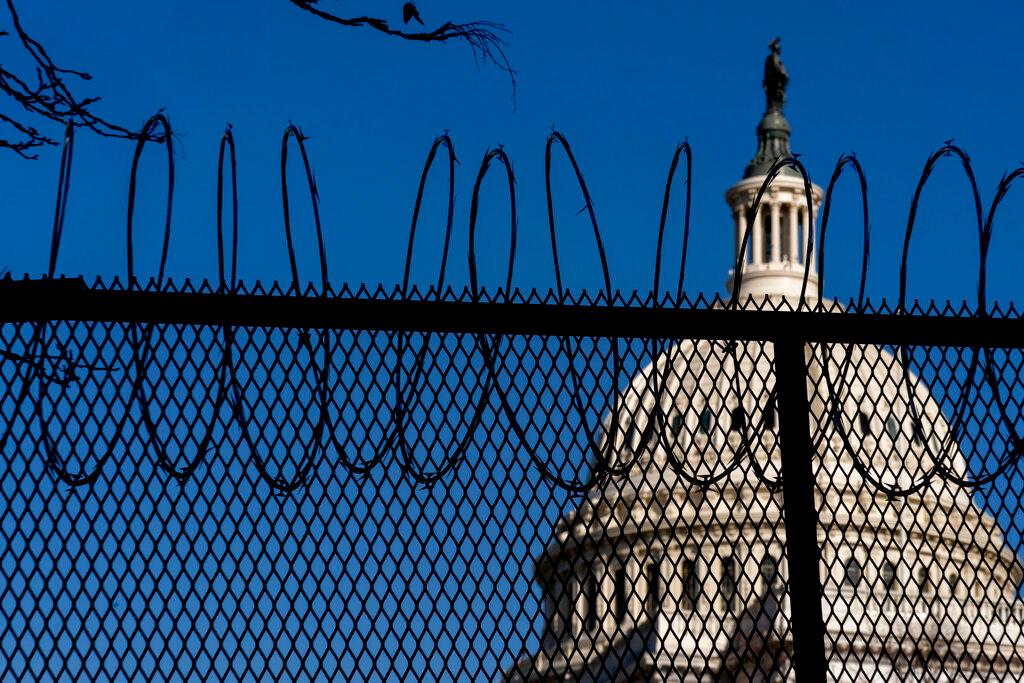 Capitol Building with razor wire fence 