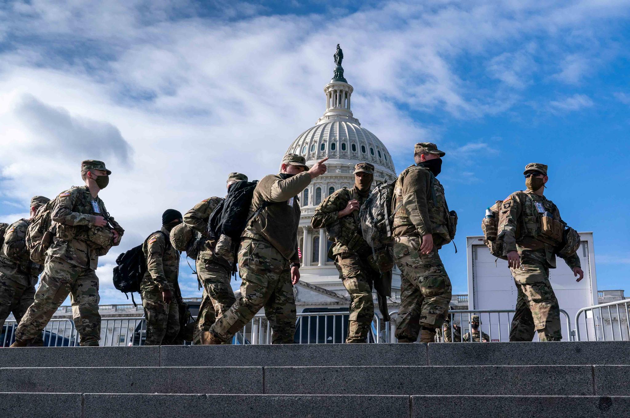 National Guard troops reinforce security around the U.S. Capitol ahead of the inauguration of President-elect Joe Biden and Vice President-elect Kamala Harris, Sunday, Jan. 17, 2021, in Washington.