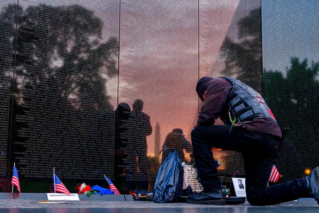 Early morning visitor to the Vietnam Veterans War Memorial in Washington