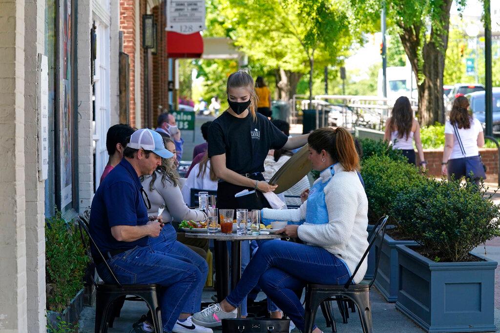 Dining along a sidewalk on Franklin Street in Chapel Hill, N.C.,
