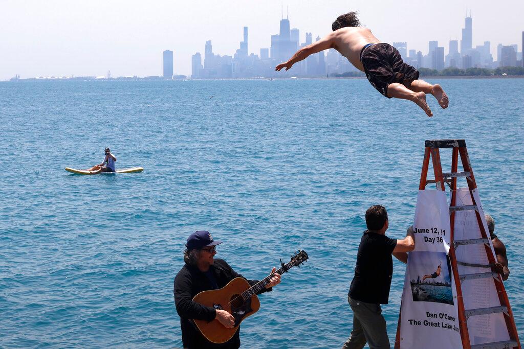 Dan O'Conor, the "Great Lake Jumper," makes his 365th leap into Lake Michigan