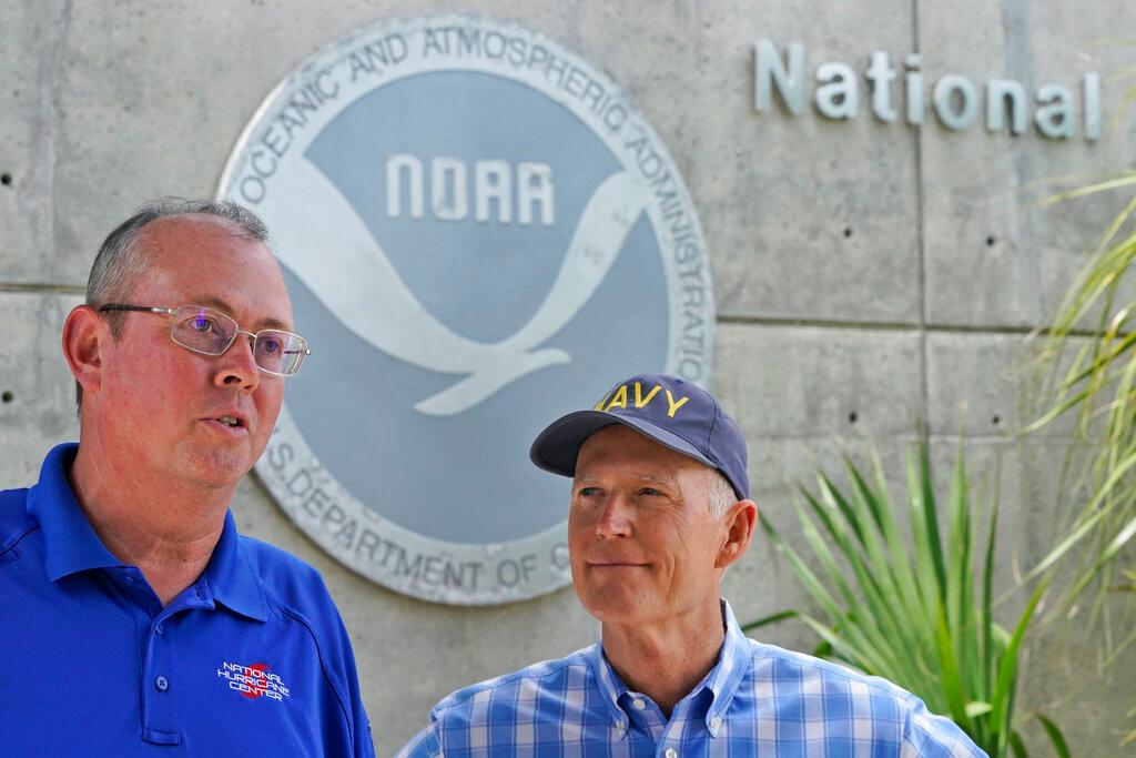National Hurricane Center director Ken Graham, left, speaks during a news conference along with Sen. Rick Scott, R-Fla.,Tuesday, June 1, 2021, at the center in Miami. Tuesday marks the start of the 2021 Atlantic hurricane season which runs to Nov. 30.