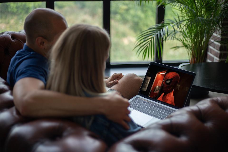 Couple watching movie on laptop 
