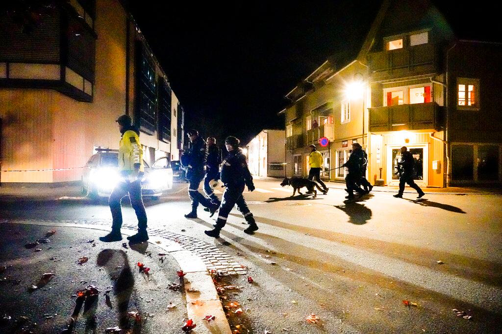 Police stand at the scene after an attack in Kongsberg, Norway, Wednesday, Oct. 13, 2021. Several people have been killed and others injured by a man armed with a bow and arrow in a town west of the Norwegian capital, Oslo.